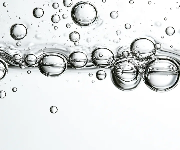 Bubbles moving through clear liquid